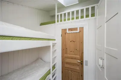 a small room with bunk beds and a door at BL441-Pandrup-Sydvej-14 in Pandrup