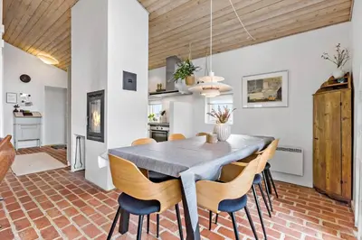 a kitchen and dining room with a table and chairs at BL1773-Saltum-Egernvej-6 in Saltum