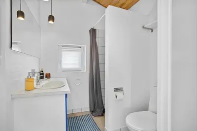a white bathroom with a sink and a toilet at BL1773-Saltum-Egernvej-6 in Saltum