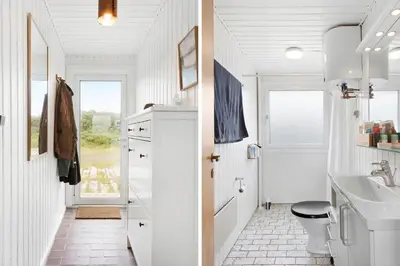 a white bathroom with a toilet and a sink at BL1580-Saltum-Kohlsvej-17 in Saltum