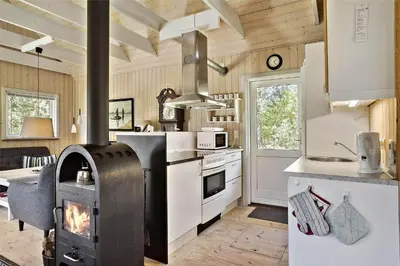 a kitchen with a stove top oven in a kitchen at BL238-Pandrup-Fyrregangen-18 in Pandrup