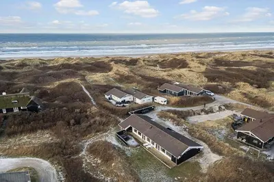 an aerial view of a house near the ocean at BL738-Saltum-Graabakken-53 in Saltum