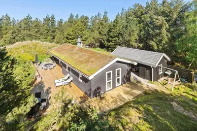 an overhead view of a house with a grass roof at BL1585-Blokhus-Bregnehojvej-1 in Blokhus