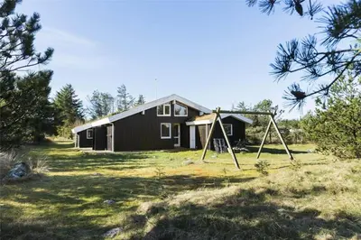 a house with a playground in front of it at BL1720-Saltum-Kvansletten-27 in Saltum