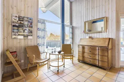 a room with a table and two chairs and a dresser at BL1720-Saltum-Kvansletten-27 in Saltum