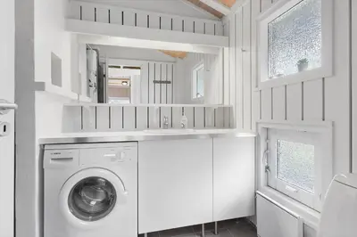 a white laundry room with a washer and dryer at BL343-Saltum-Raabukvej-24 in Saltum