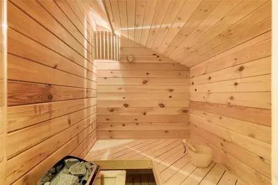 an empty sauna with a wooden wall at BL1788-Blokhus-Gyvelvej-21 in Blokhus