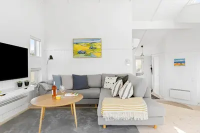 a living room with a couch and a table at BL832-Saltum-Kohlsvej-8 in Saltum