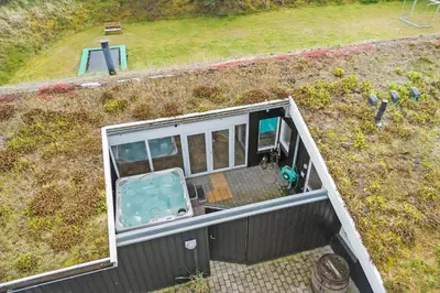 an aerial view of a house with a swimming pool at BL1418-Blokhus-Malinsvej-14 in Blokhus