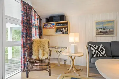 a living room with a couch and a table at BL1558-Saltum-Opossumvej-20 in Saltum