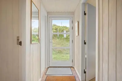 a hallway with a door and a window at BL1558-Saltum-Opossumvej-20 in Saltum