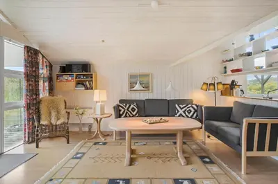 a living room with a couch and a table at BL1558-Saltum-Opossumvej-20 in Saltum