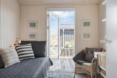 a bedroom with a bed and a sliding glass door at BL1746-Saltum-Kalundborgvej-23 in Saltum