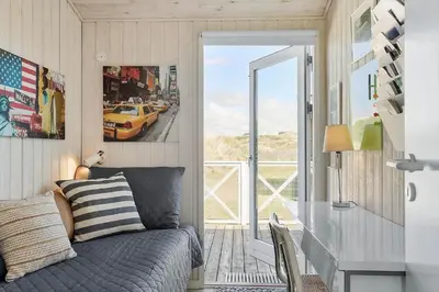 a bedroom with a bed and a sliding glass door at BL1746-Saltum-Kalundborgvej-23 in Saltum