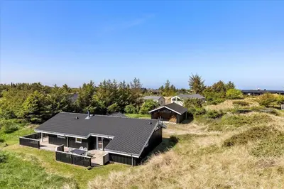 an aerial view of a house on a hill at BL1751-Blokhus-Wolundsvej-4-A in Blokhus