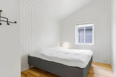 a bed in a white room with a window at BL1559-Saltum-Nordvestvej-25 in Saltum