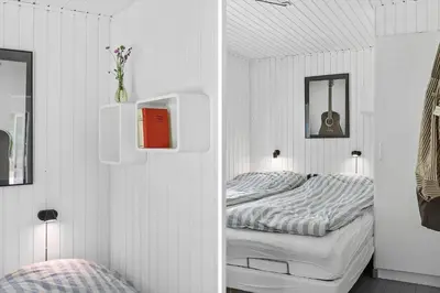a small bedroom with two beds in a room at BL1494-Saltum-Viborgvej-6 in Saltum