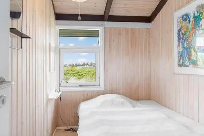 a small room with a bed and a window at BL687-Saltum-Porsevej-16 in Saltum