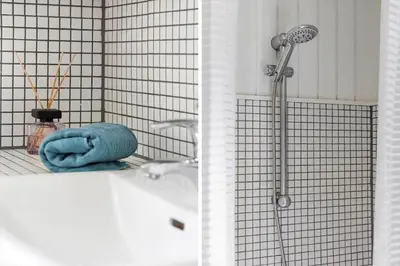 a shower in a bathroom with a tub and a shower head at BL1082-Blokhus-Klintevej-12 in Blokhus