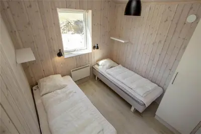a room with two beds and a window at BL117-Pandrup-Marsvinet-30 in Pandrup