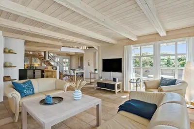 a living room with two couches and a tv at BL1647-Saltum-Graabakken-46 in Saltum