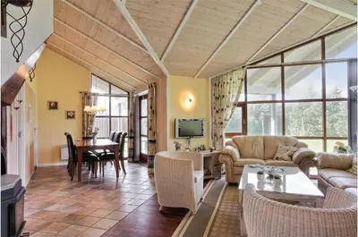 a living room with a couch and a table at BL861-Blokhus-Pirupshvarrevej-49 in Blokhus