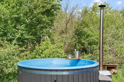 a blue hot tub sitting on top of a table at BL1364-Saltum-Tolhoj-34 in Saltum