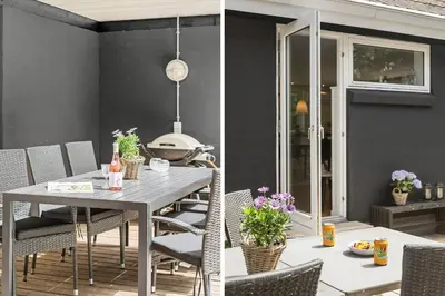 a dining room with a table and chairs at BL1205-Blokhus-Quintusvej-26 in Blokhus