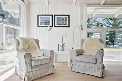 two chairs and a table in a living room at BL583-Saltum-Saltum-Strandvej-210 in Saltum
