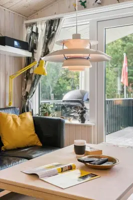 a dining room table with a light fixture and a tableablish at BL1466-Pandrup-Lunekrogen-14 in Pandrup