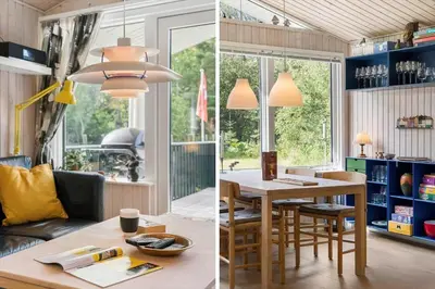a kitchen and a living room with a table and chairs at BL1466-Pandrup-Lunekrogen-14 in Pandrup