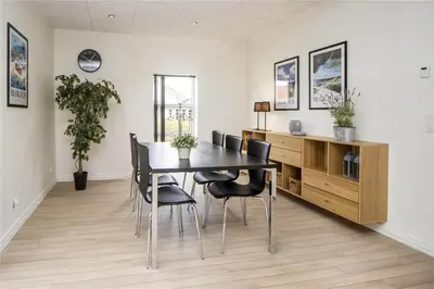 a dining room with a table and chairs at BL139-Blokhus-Klitvejen-4-A in Blokhus