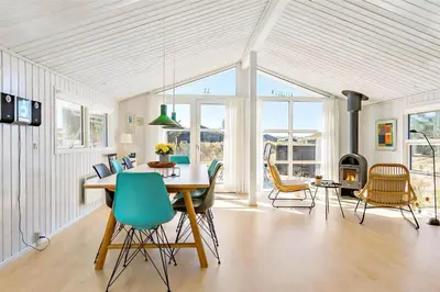 a dining room with a table and chairs at BL418-Pandrup-Hunetorp-Klitvej-141 in Pandrup