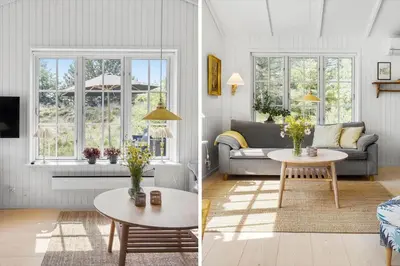 a living room with a couch and a table at BL1756-Blokhus-Bregnehojvej-7-A in Blokhus