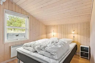 a large bed in a room with a window at BL1678-Pandrup-Hunetorp-Klitvej-1-B in Pandrup