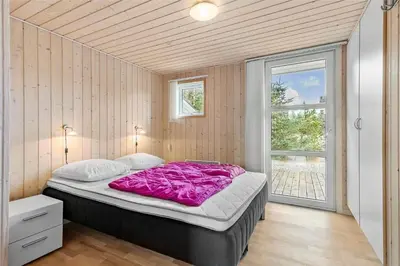 a large bed in a room with a window at BL1678-Pandrup-Hunetorp-Klitvej-1-B in Pandrup