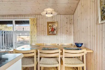 a dining room with a table and chairs at BL1749-Pandrup-Tunen-5 in Pandrup