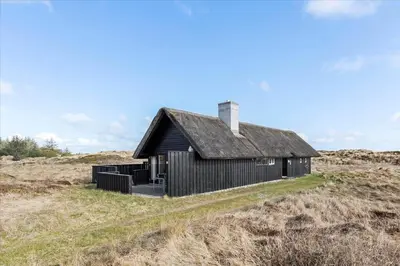 an old house on a hill in a field at BL1749-Pandrup-Tunen-5 in Pandrup
