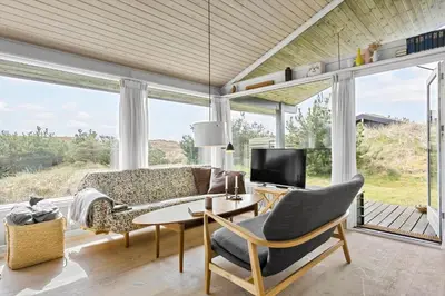a living room with a couch and a table at BL1696-Saltum-Kordalslien-9 in Saltum