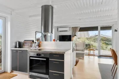 a kitchen with a stove top oven in a room at BL1314-Pandrup-Nordvej-11 in Pandrup