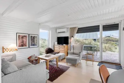 a living room with a couch and a table at BL1314-Pandrup-Nordvej-11 in Pandrup