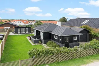 an aerial view of a black house at BL1612-Blokhus-Jens-Baerentsvej-3 in Blokhus