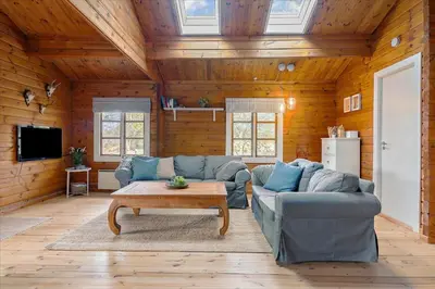 a living room with a couch and a coffee table at BL969-Blokhus-Bregnehojvej-16 in Blokhus