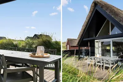 a house with a picnic table in front of it at BL830-Pandrup-Bardehvalen-3 in Pandrup