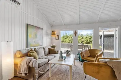 a living room with a couch and a table at BL1654-Saltum-Ornebjergvej-11 in Saltum
