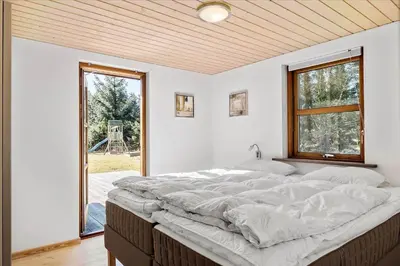 a large bed in a room with a window at BL451-Saltum-Trehoje-14 in Saltum