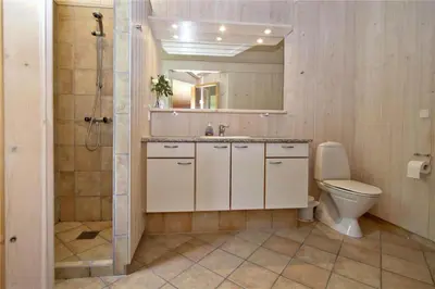 a bathroom with a toilet and a sink and a shower at BL178-Saltum-Ornebjergvej-16 in Saltum