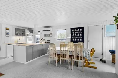 a kitchen and dining room with a table and chairs at BL1029-Pandrup-Rodhus-Skolevej-9 in Pandrup