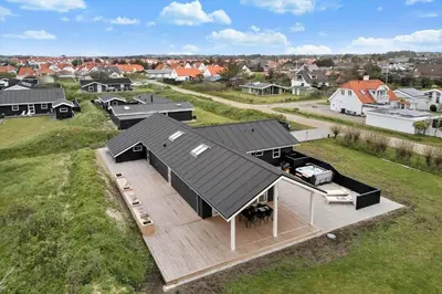 an overhead view of a house with a black roof at BL1355-Blokhus-Ribergaardsvej-24 in Blokhus