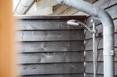 a shower in the side of a house at BL709-Blokhus-Kr-Thomsensvej-5 in Blokhus